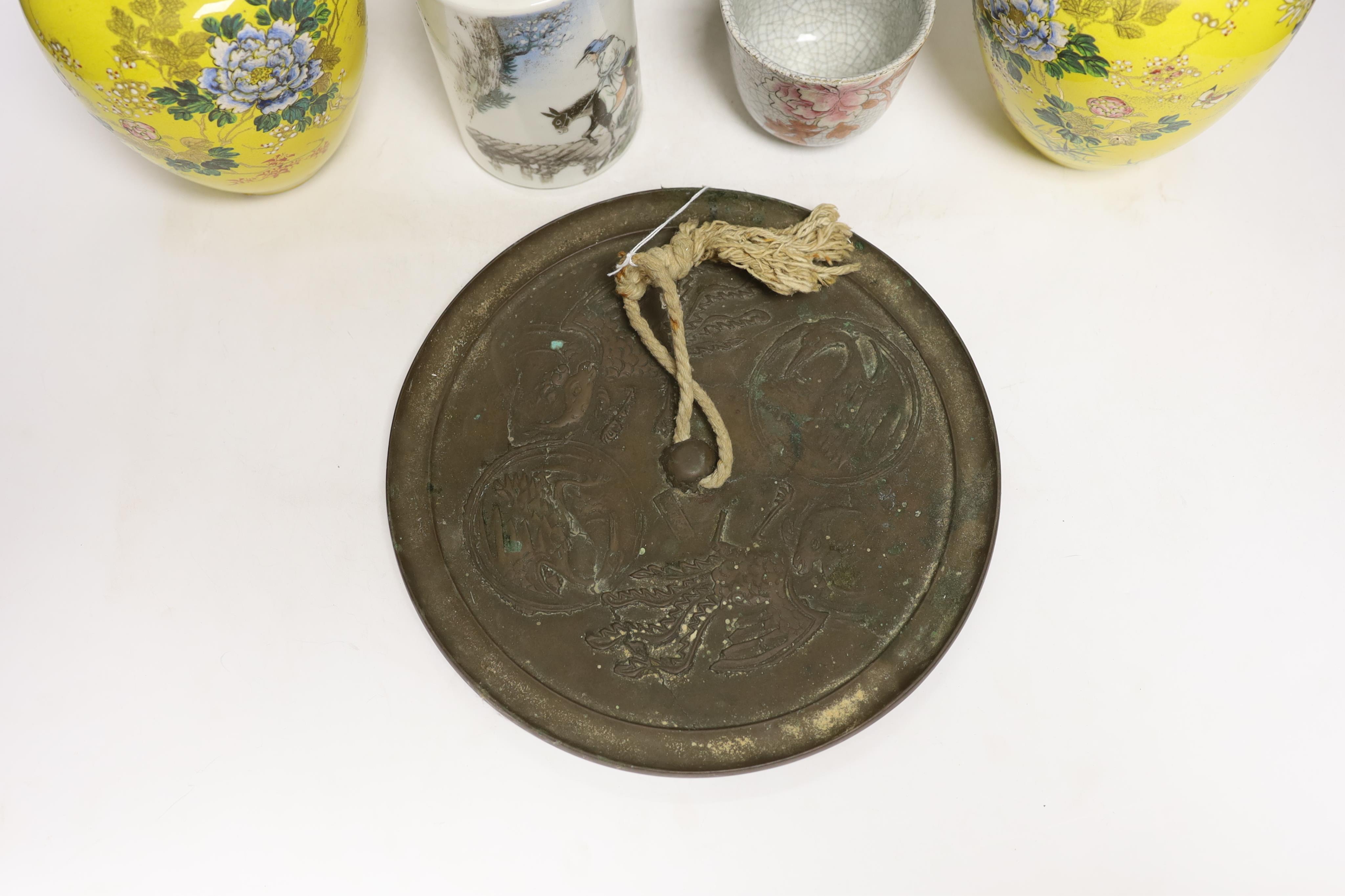 A 19th century Chinese famille rose tureen (lacking cover), a bronze mirror, a brush pot, a crackle glazed teabowl and a pair of Japanese yellow glazed satsuma jars and covers, tallest 18cm (6)